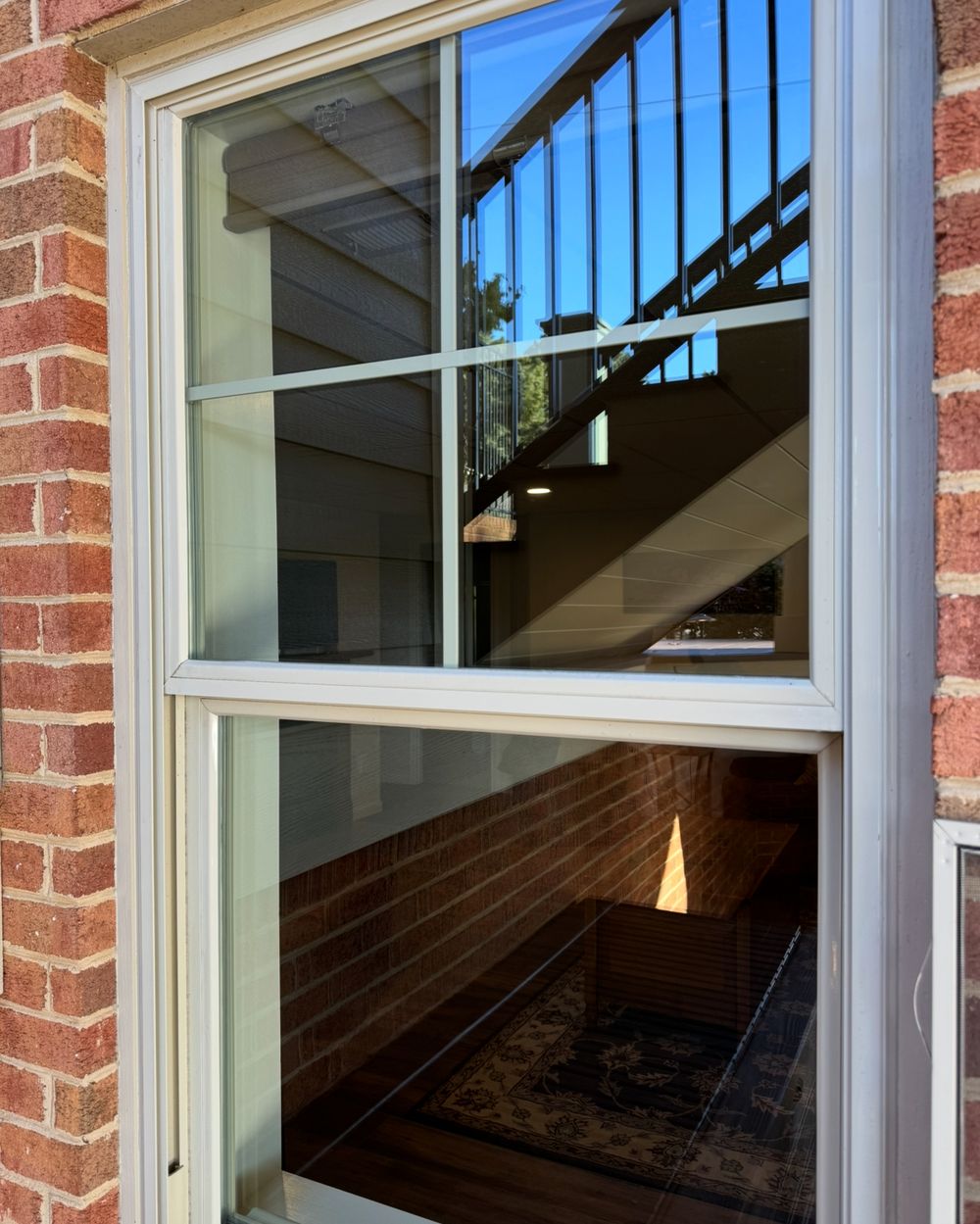 Streak-free double-hung window in a brick wall